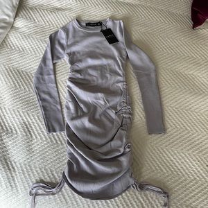 Long sleeve mini dress with tags never been worn
